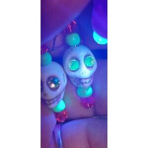 Halloween howlite skull earrings with uranium rhinestones and uv reactive beads